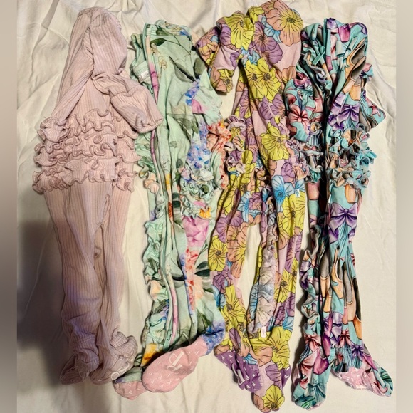 Bundle of 4 New born ruffled posh peanut onsies!